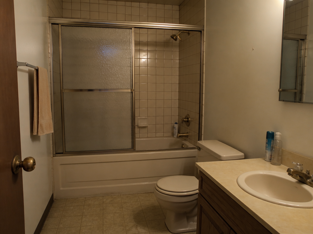 Illustrative example of a dated bathtub and shower in an older bathroom